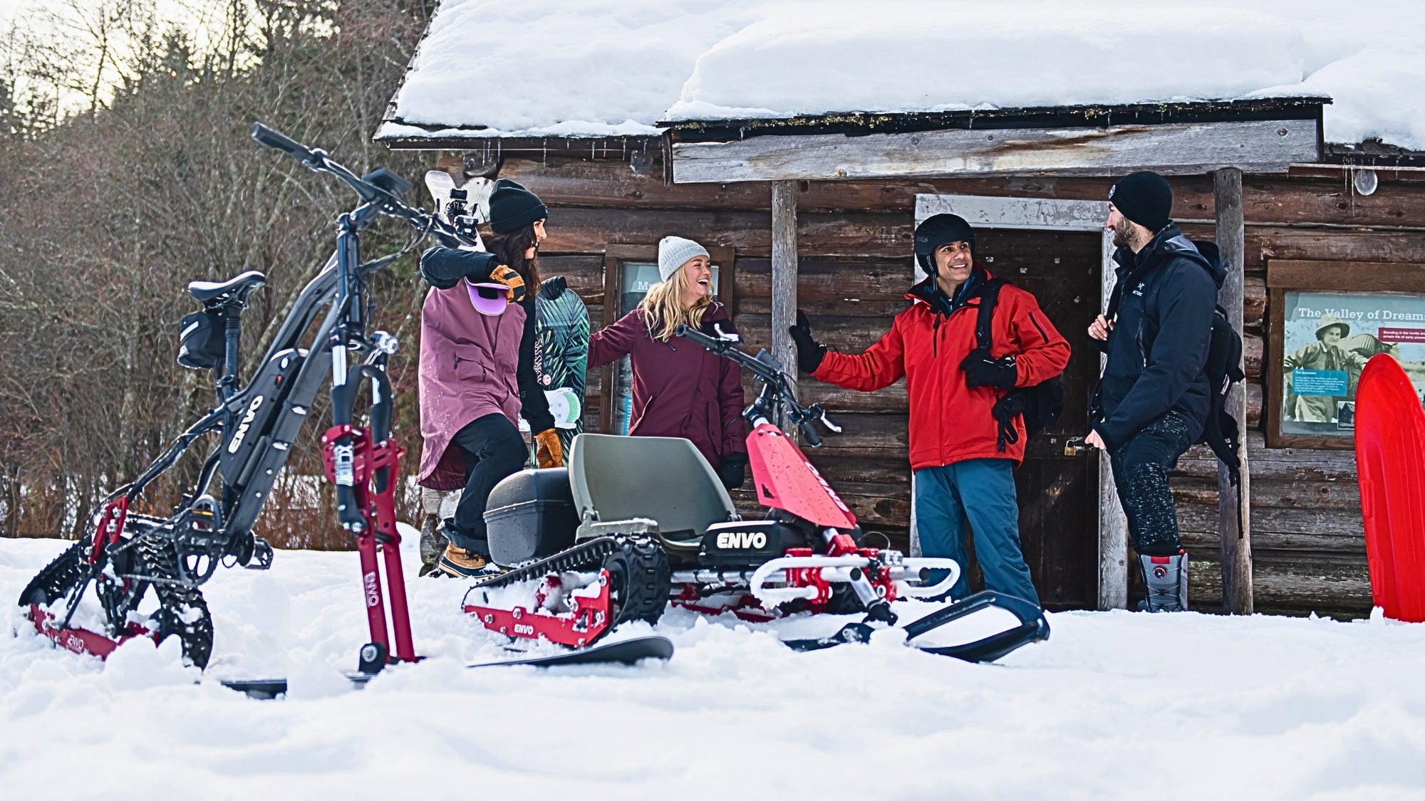 winter activity fun snow cycling and ENVO snowkart with friend by frozen lake in canada