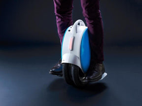 person riding Airwheel Q5 electric unicycle